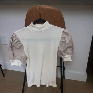 Light colored light/beige semi-see through (but professional) top
